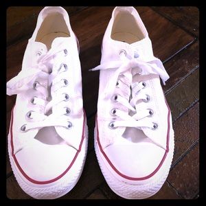 Size 9.5 in women’s Chuck Taylors.
